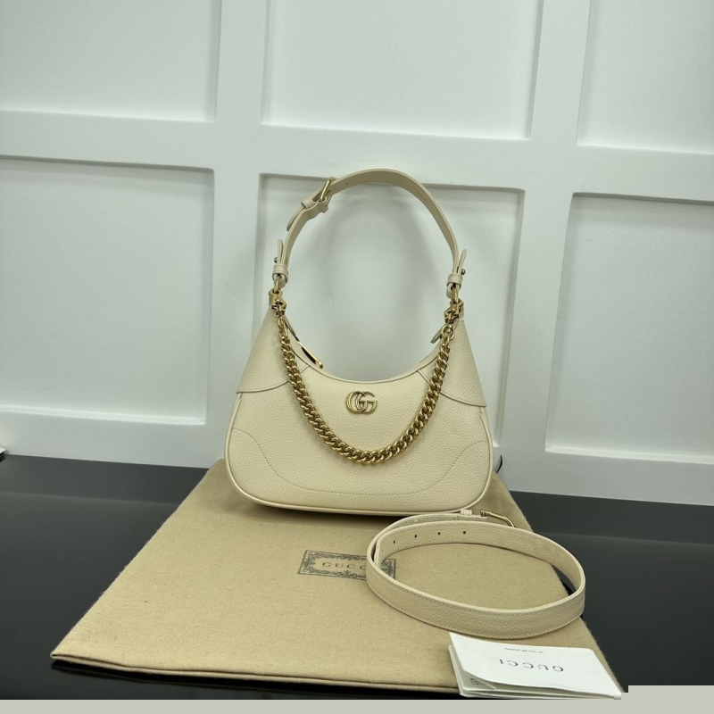 G*u*i top handle bags